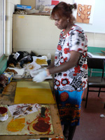 Blanche Ebatarinja working on her print at the art centre