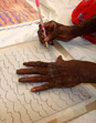 Galuku print being signed